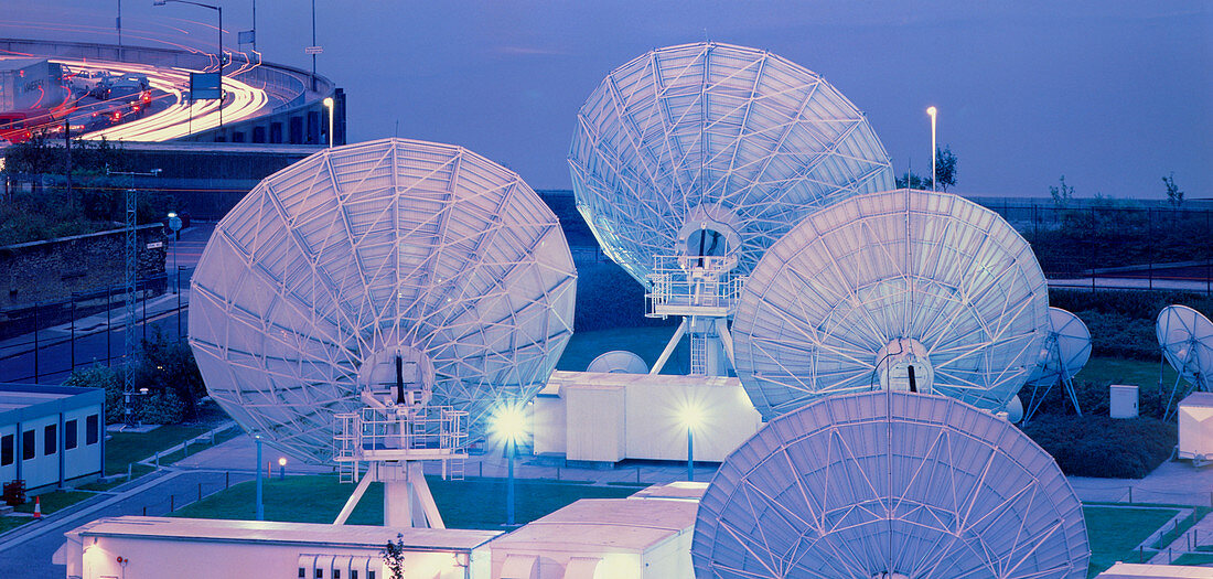 Satellite dishes at nighttime