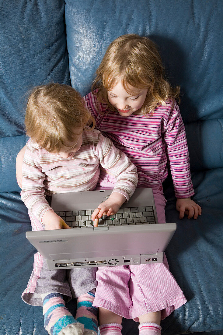 Young girls using a laptop computer