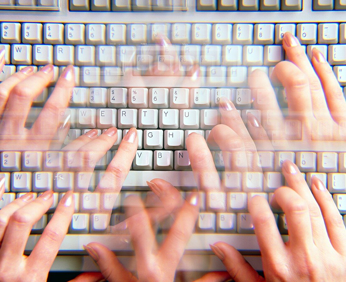 Hands on a computer keyboard