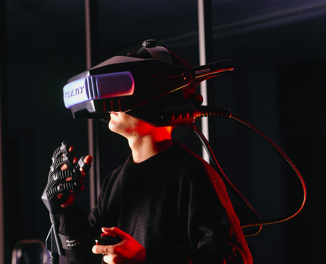 Researcher wearing virtual reality helmet & glove