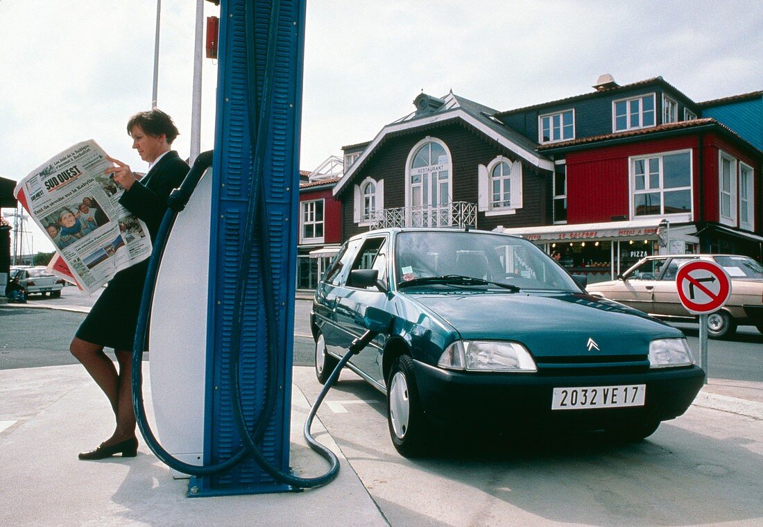 Driver recharging electric car,La Rochelle