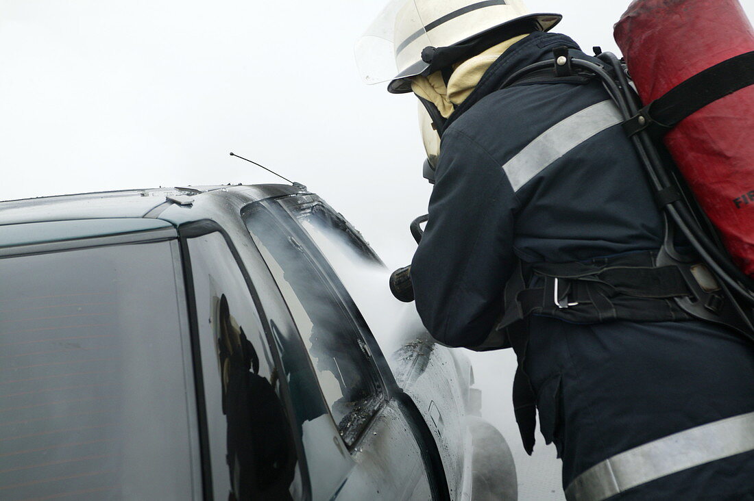 Firefighter extinguishing a fire