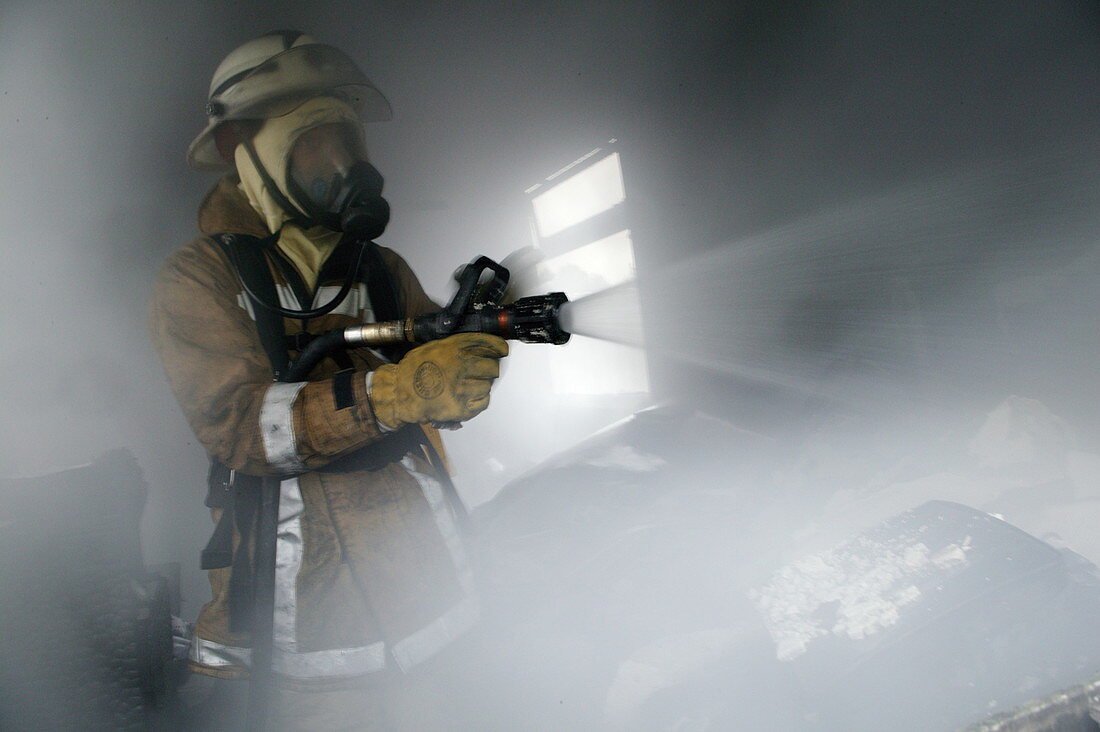 Firefighter extinguishing a fire