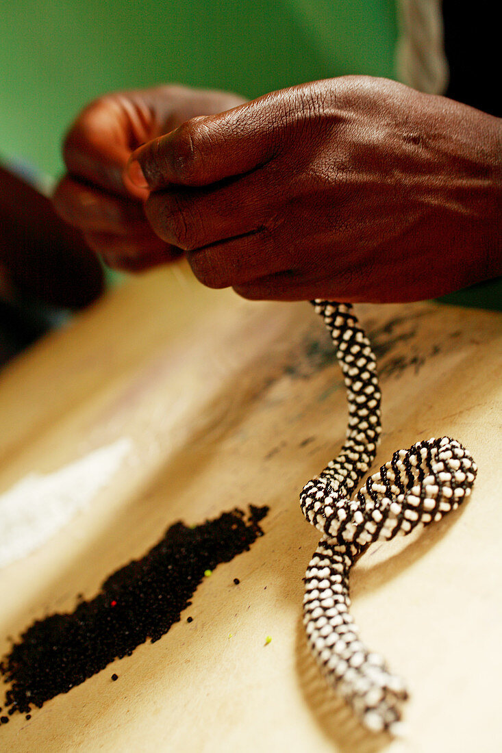 Making a belt cord,Uganda