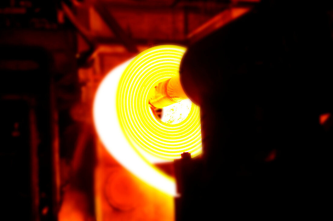 Rolling hot steel at a steel mill