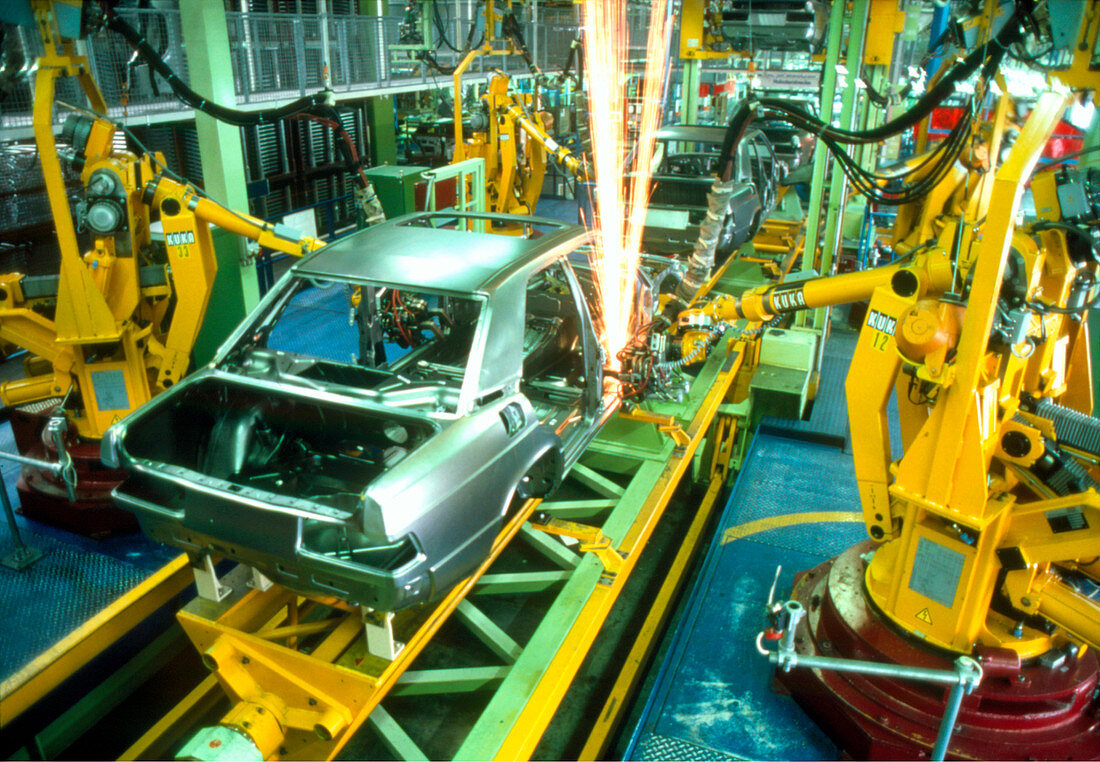 Robots welding in a car production line