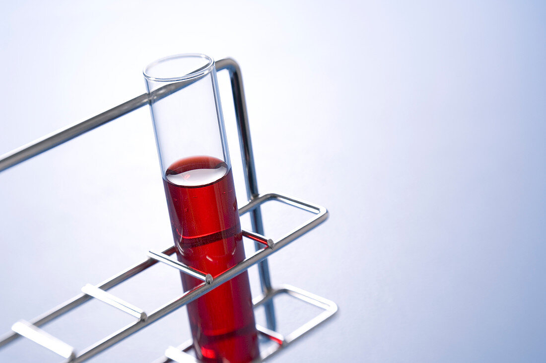 Silhouette of chemist with distillation apparatus