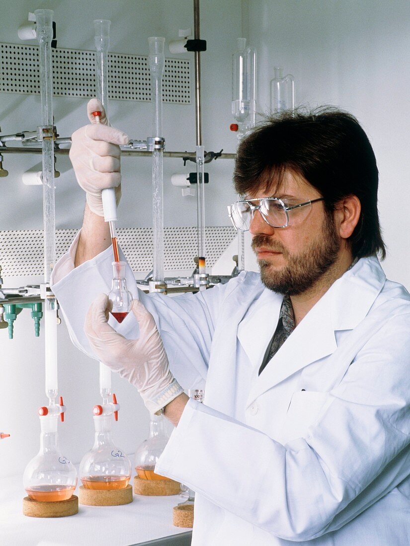 Chemist with titration equipment