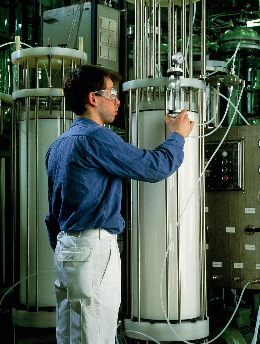 Chemist with column chromatography equipment