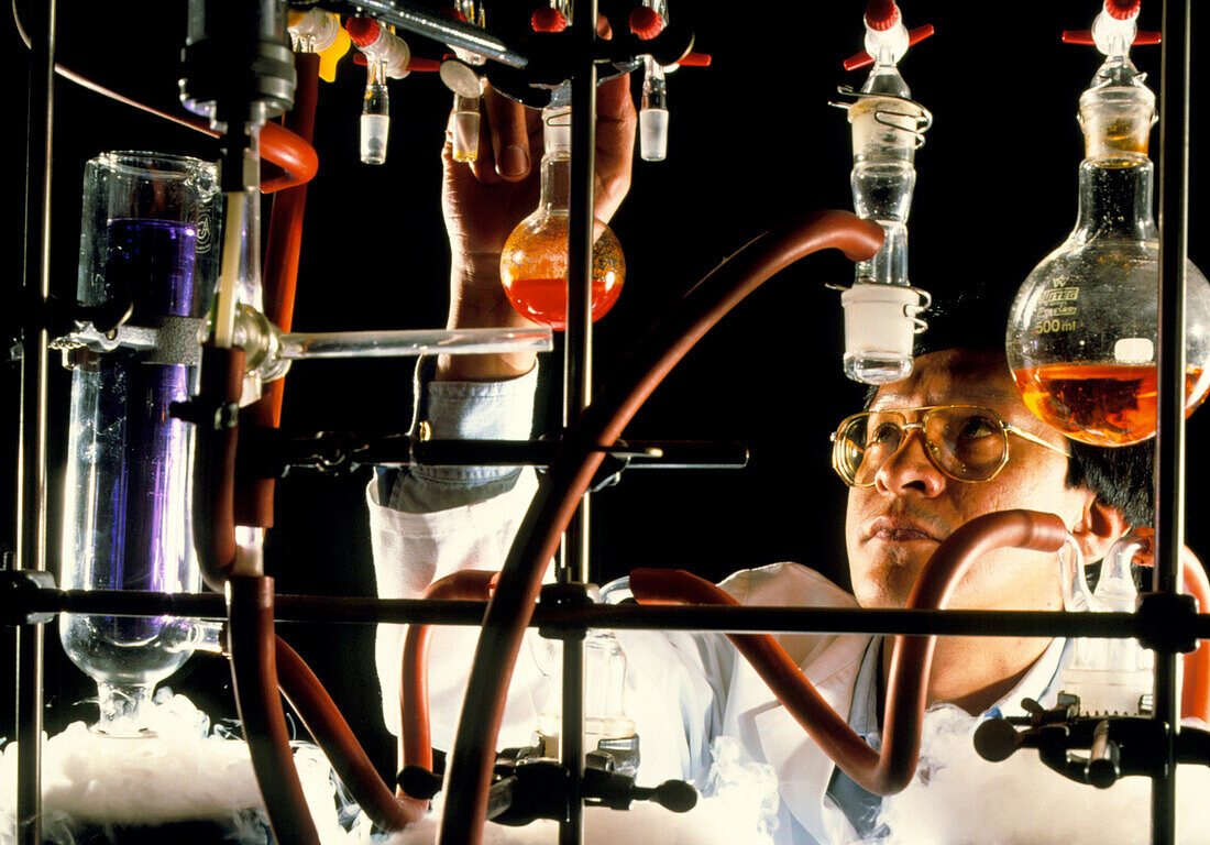 Chemist in laboratory conducting research