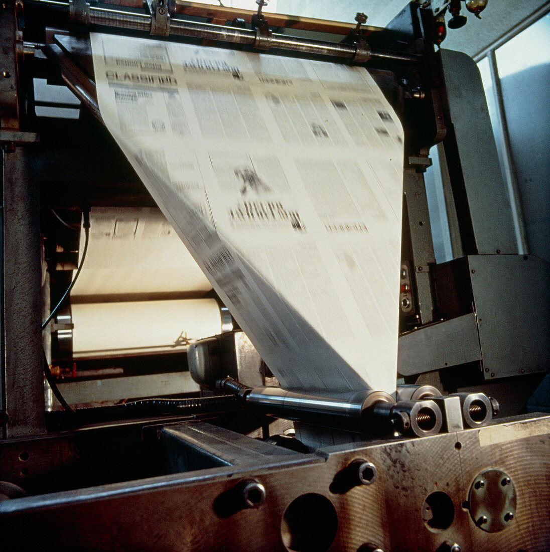 Sheet-folding end of a newspaper printing press