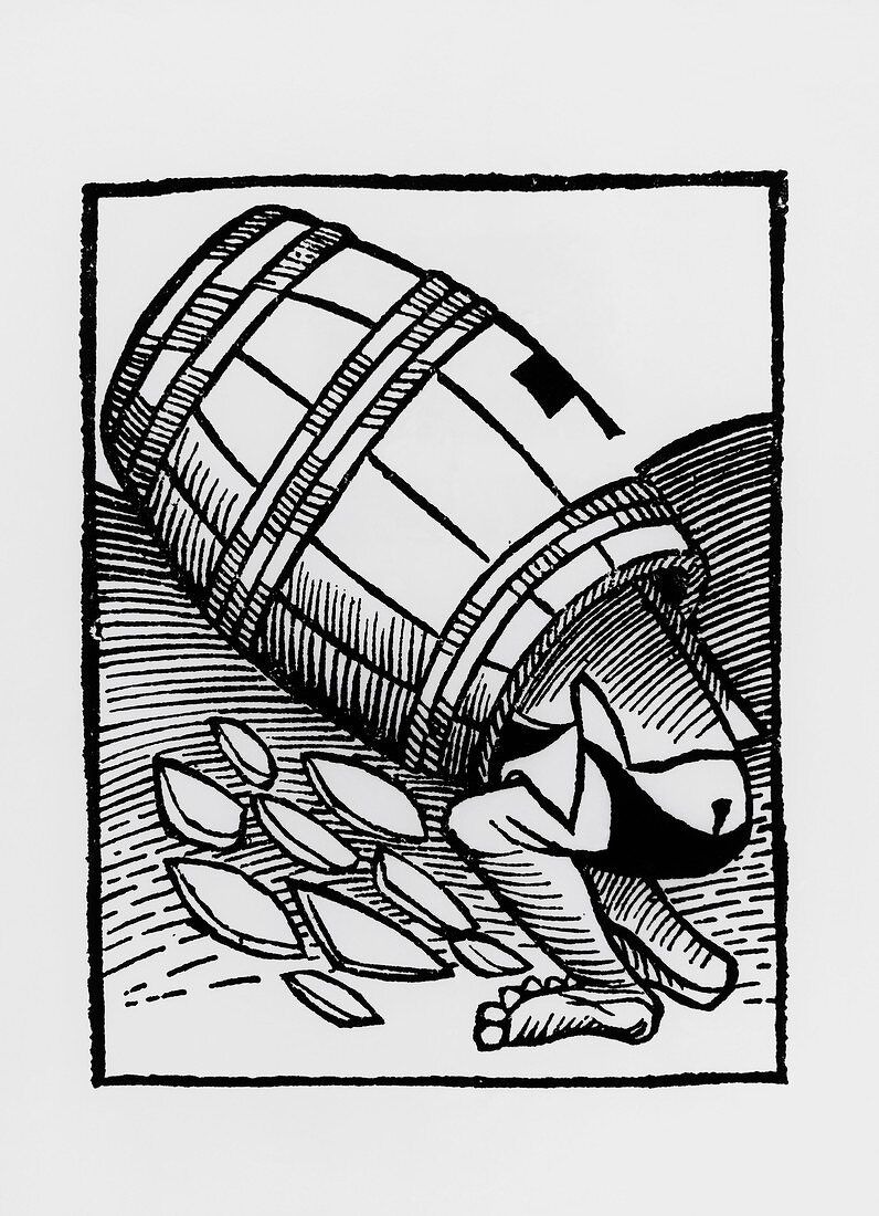 Man collecting tartar from a empty wine barrel