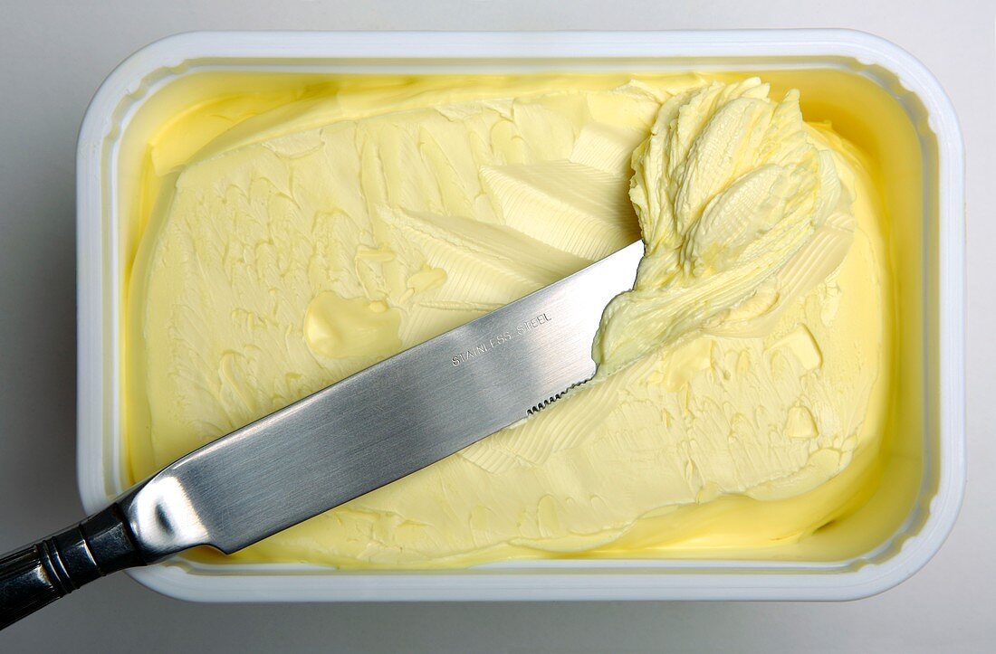 Knife and tub of margarine