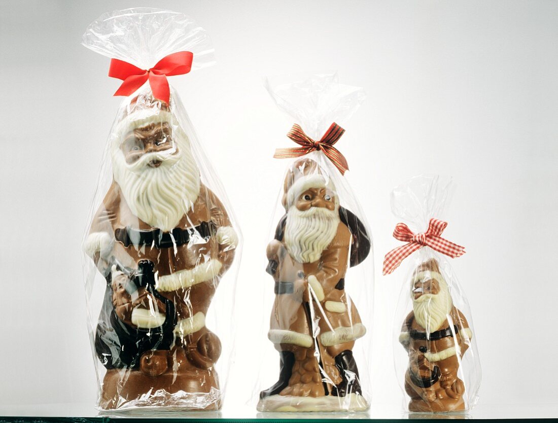 Three packed chocolate Father Christmases