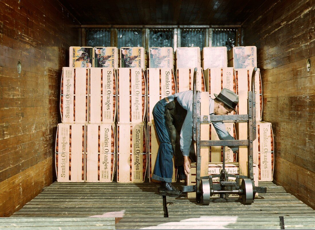 Refrigerating crates of oranges,1940s
