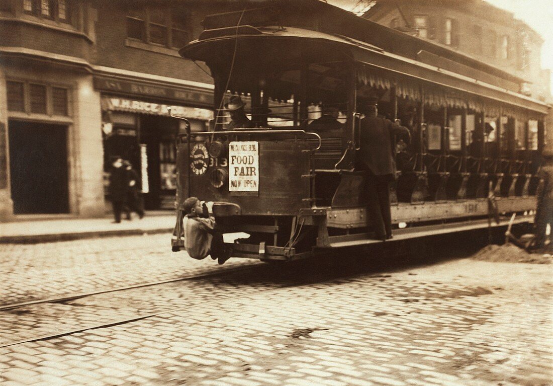 Child riding on a tram,Boston,1909