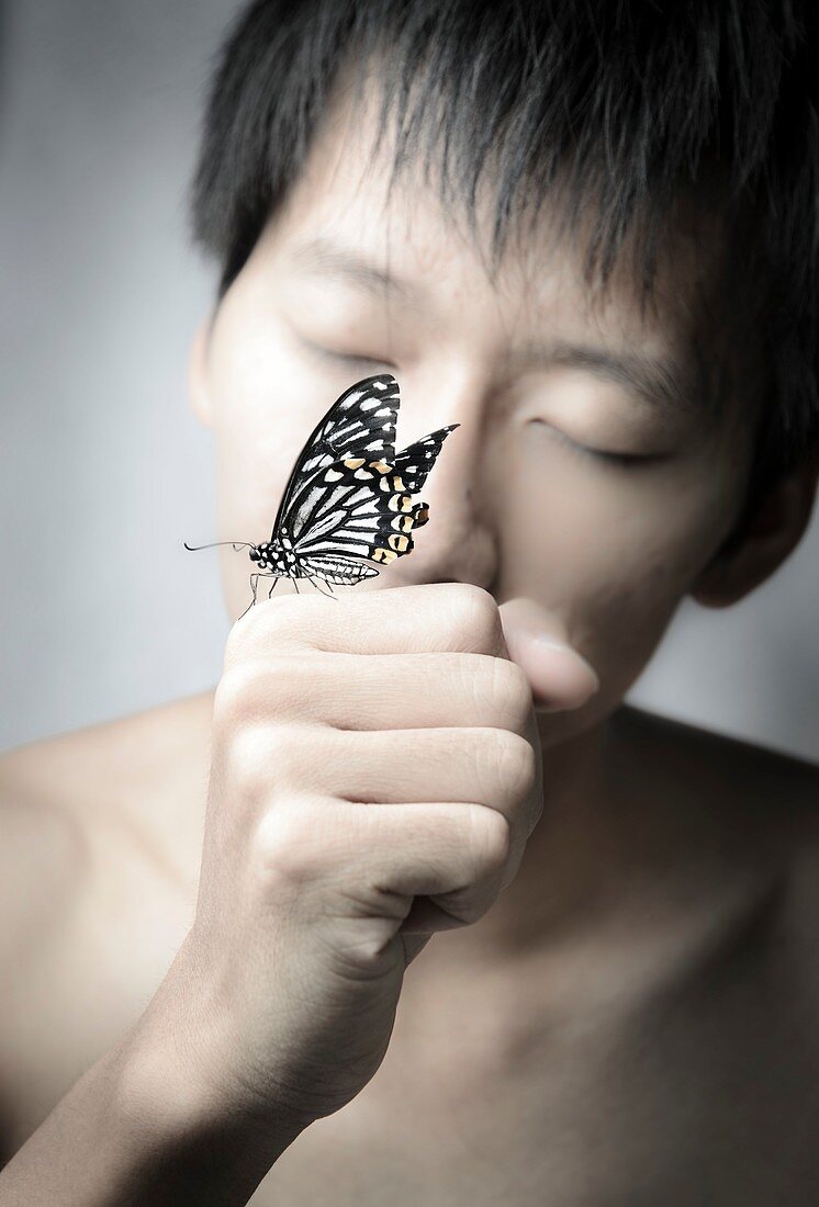Man holding a butterfly