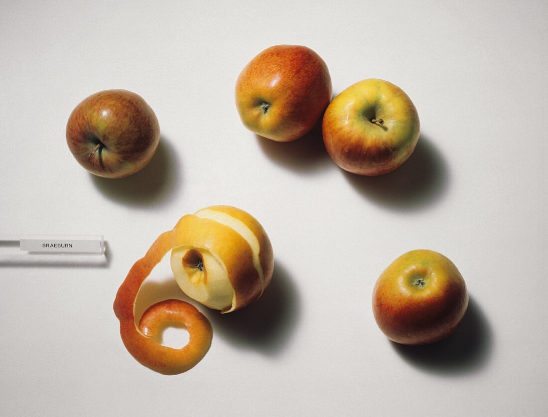 Five Braeburn Apples; One Peeled