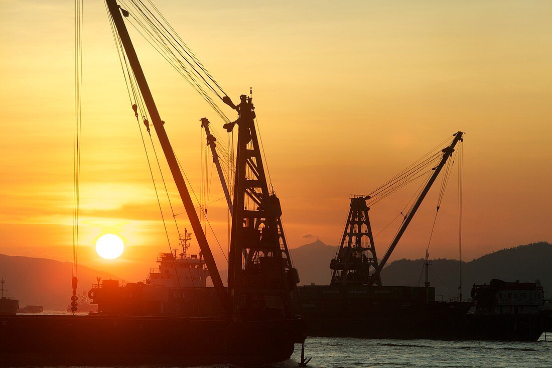 Crane barges at dusk