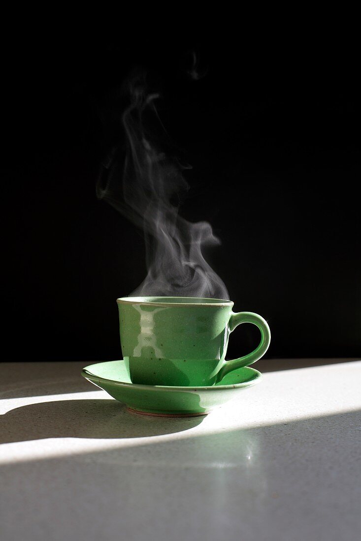 Steam rising from hot drink