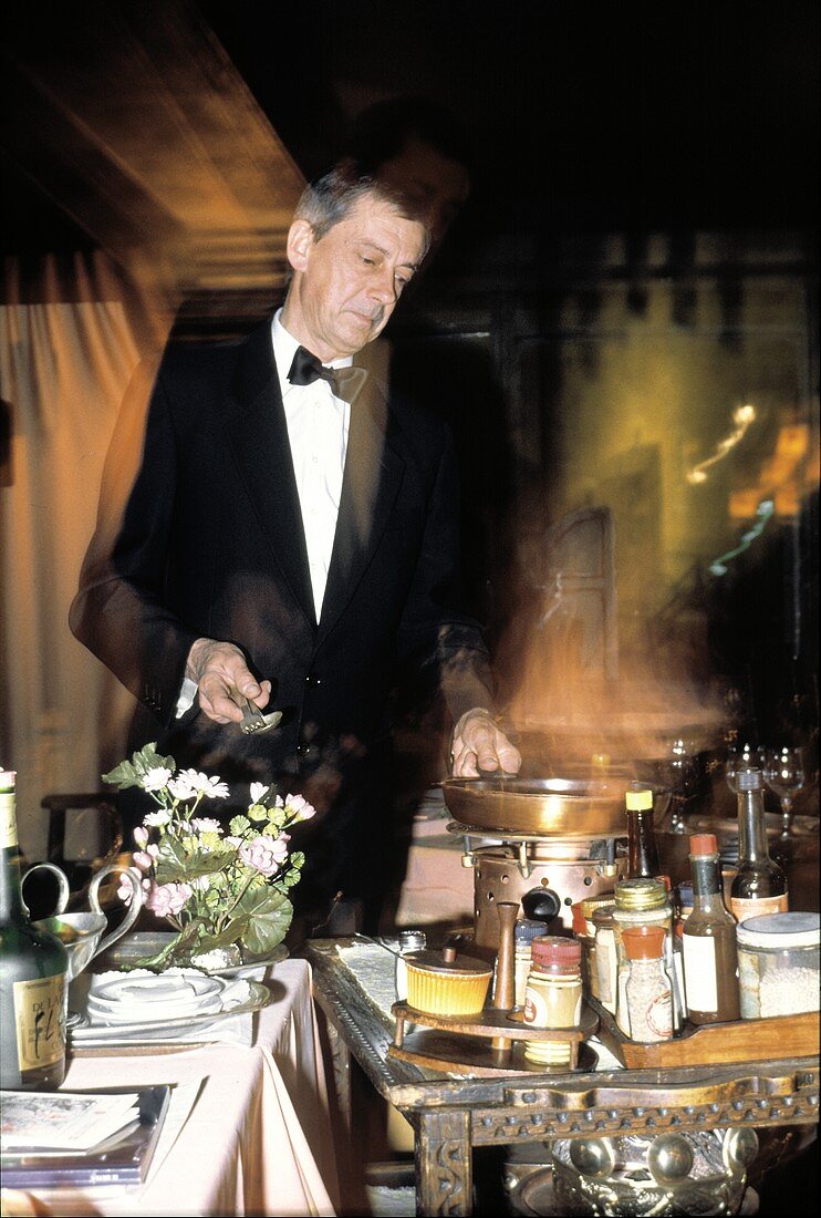 Waiter Preparing Flambee in a Restaurant