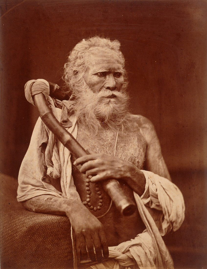 Sadhu Faqir holding a pipe