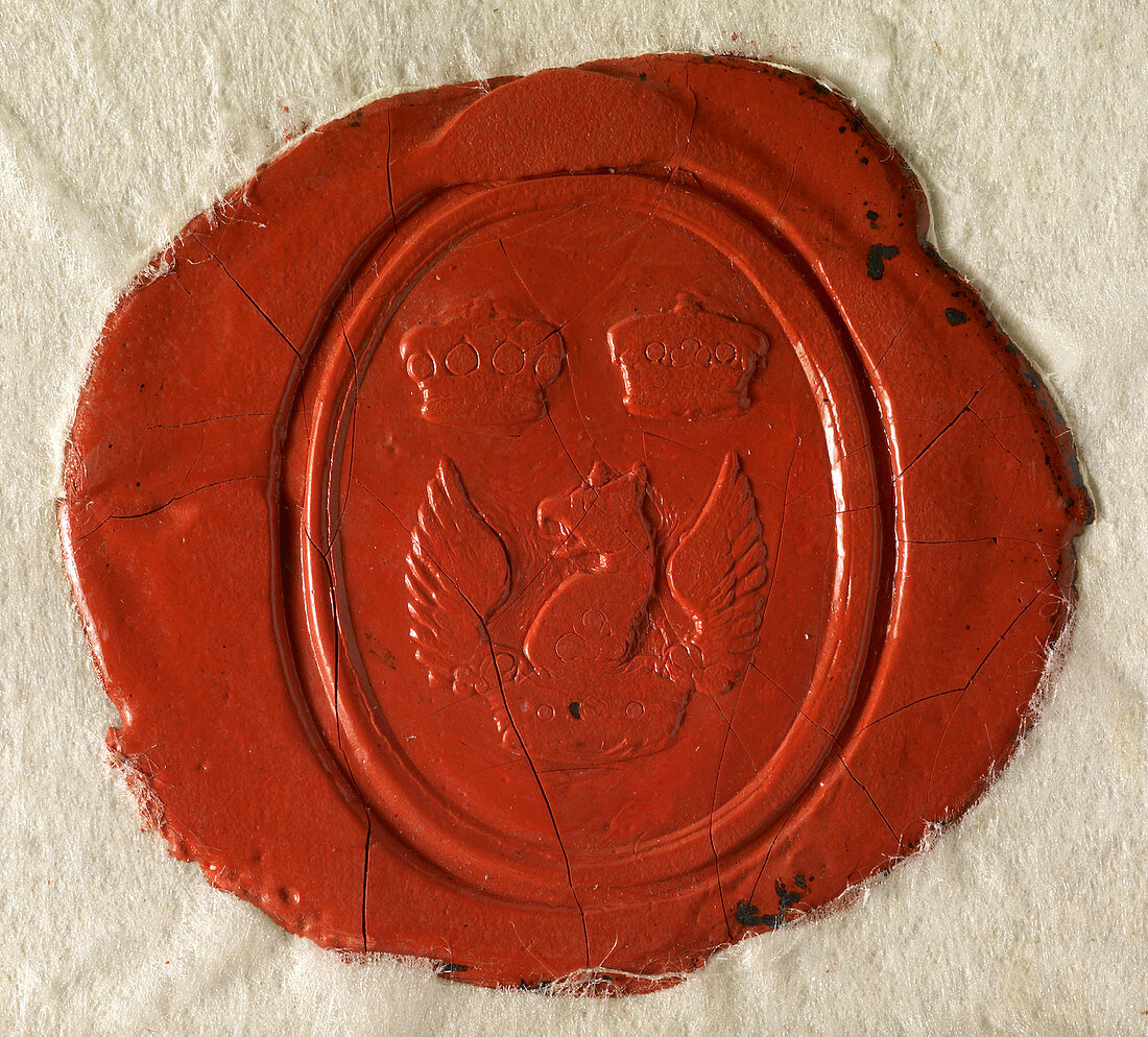 A red seal showing a coat of arms