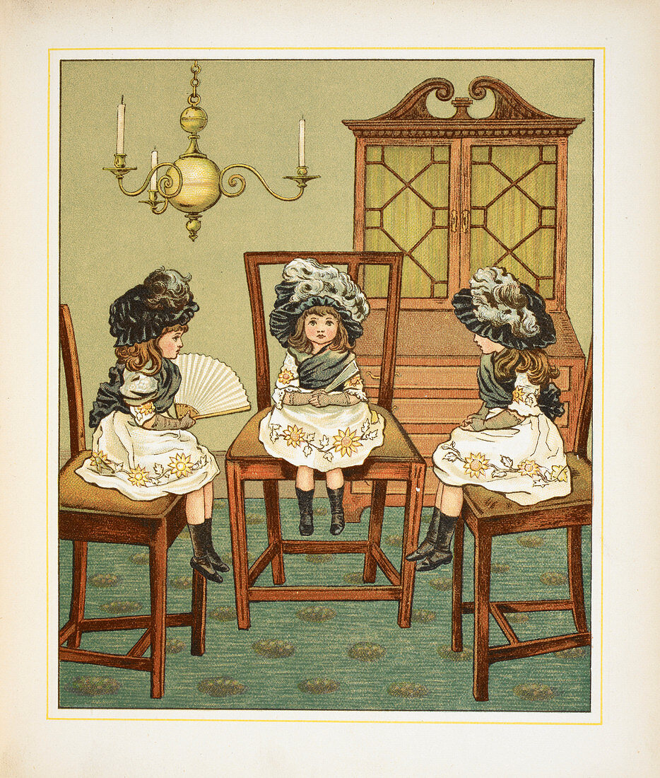 Three little girls sitting on chairs