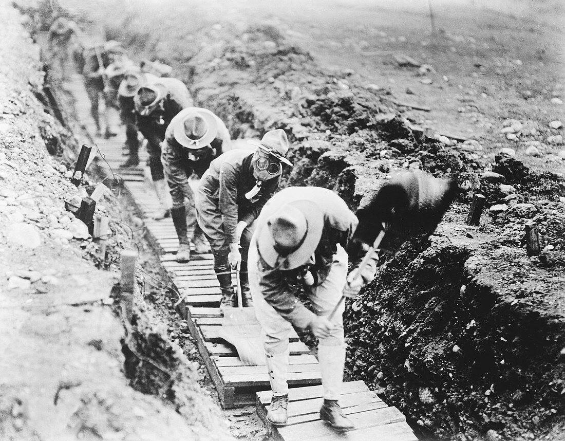 Soldiers fanning gas from a trench,WWI