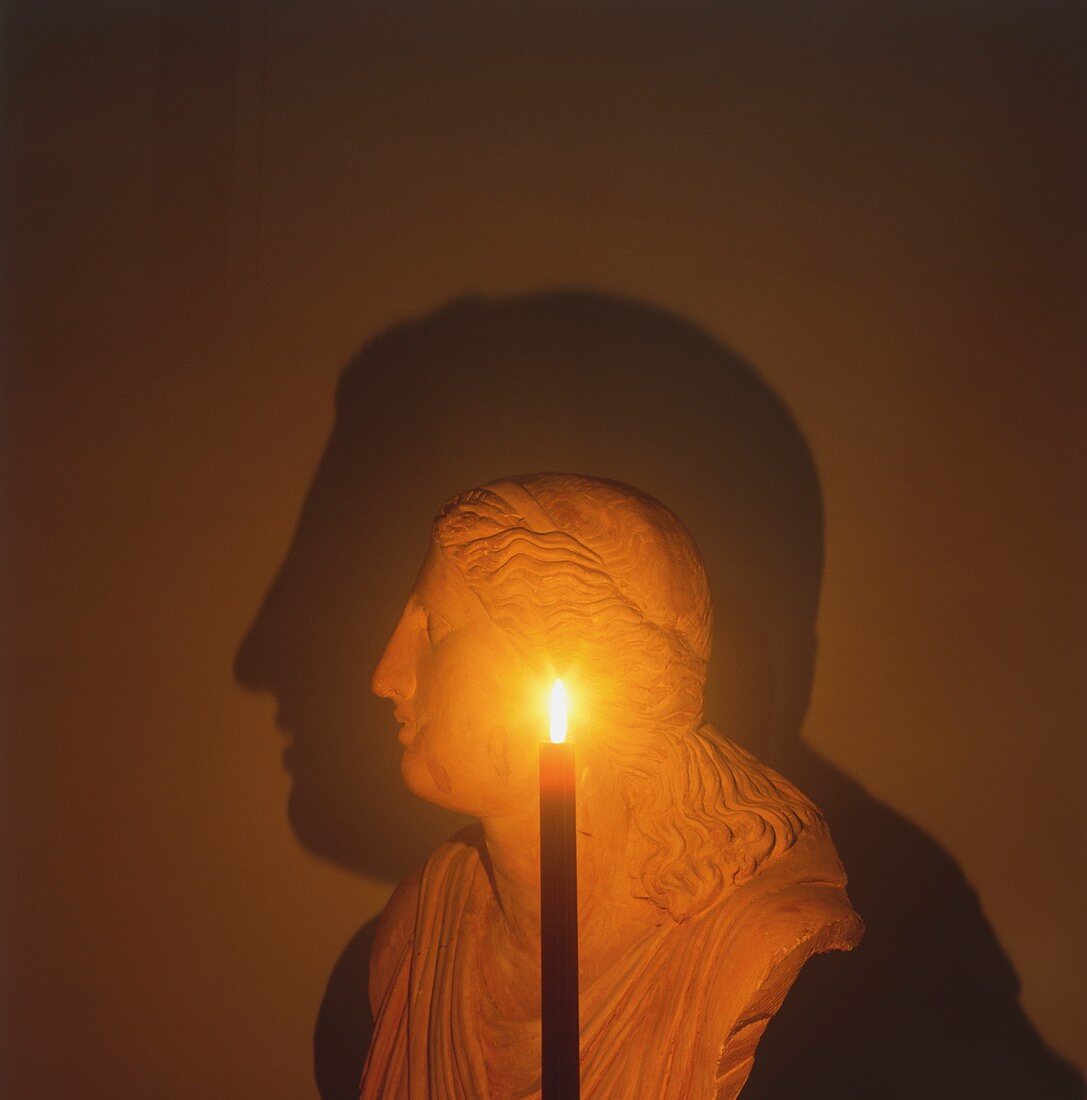 Shadow of a bust in candle light