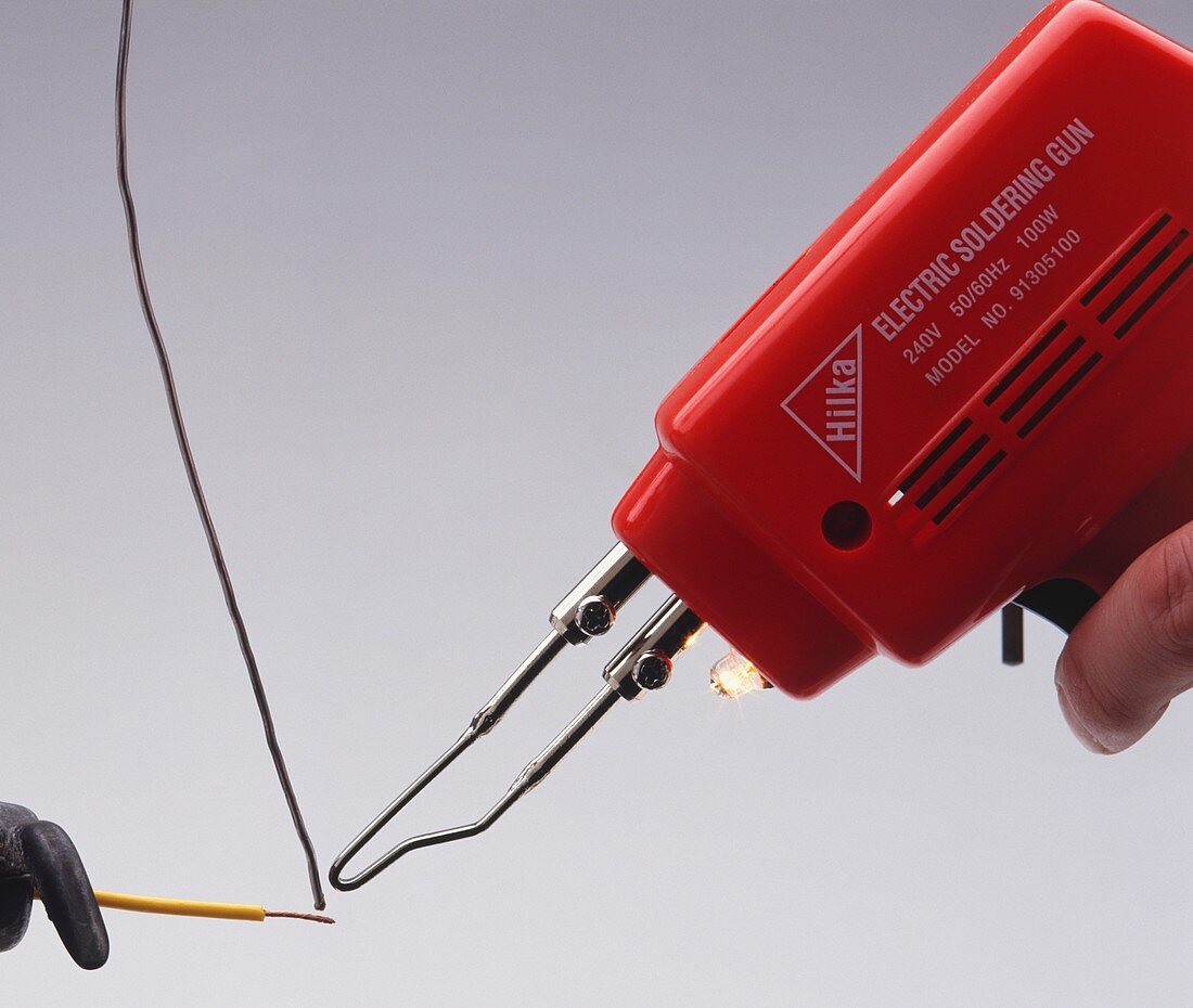 Electrical soldering iron with solder