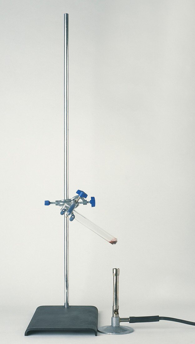 Test tube angled in a clamp stand