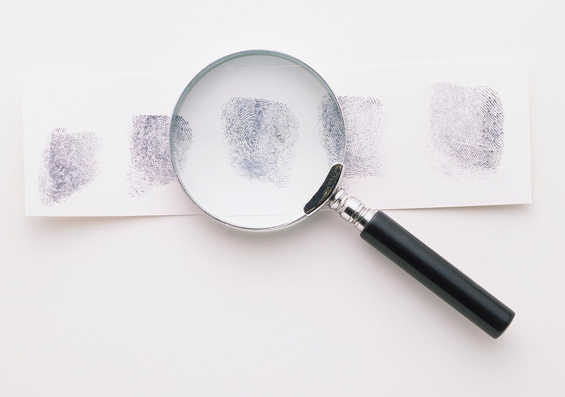 Fingerprints and magnifying glass