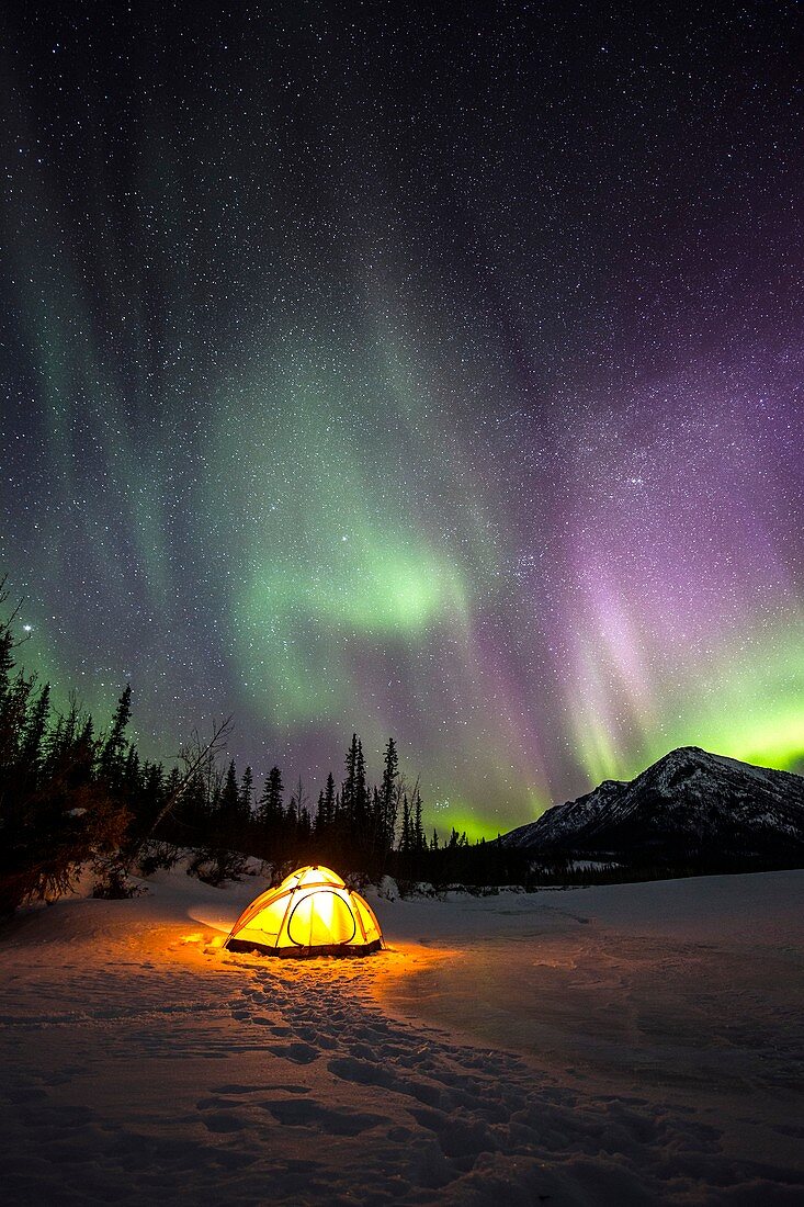 Aurora Borealis over campsite in Alaska