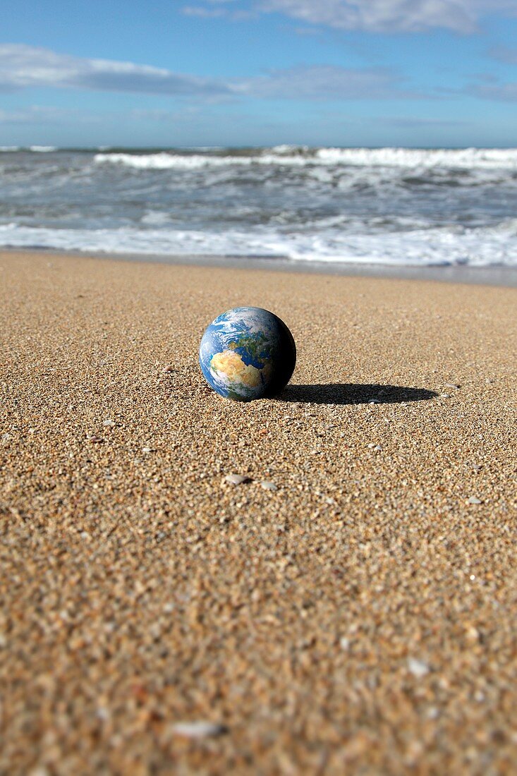 Earth on a beach,composite image