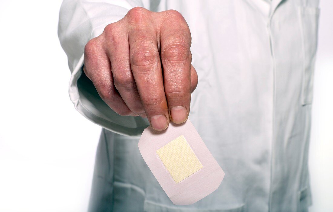 Doctor holding a plaster