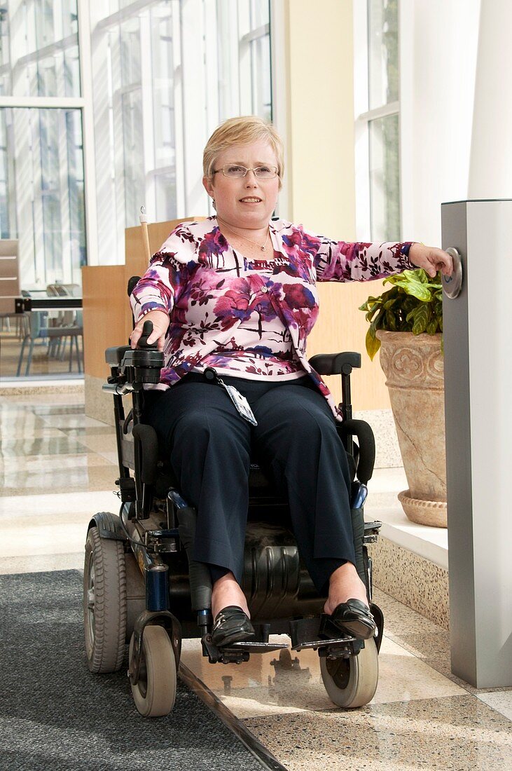 Woman in a motorised wheelchair