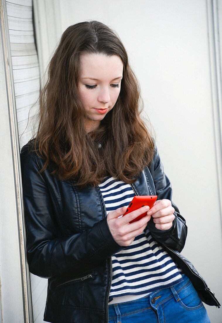 Teenage girl text messaging