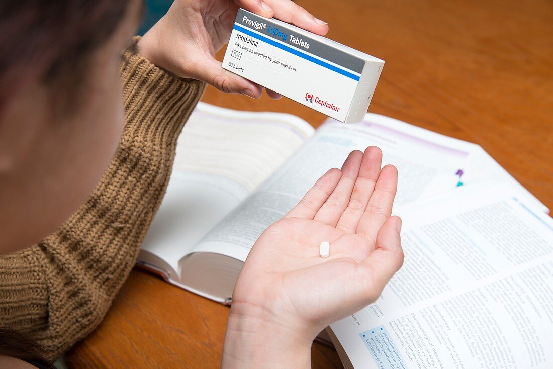 Woman reading about modafinil