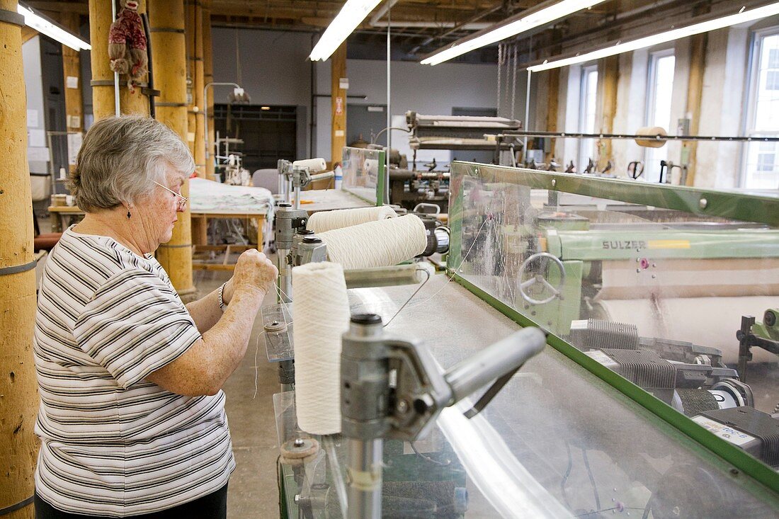 Textile mill loom operator