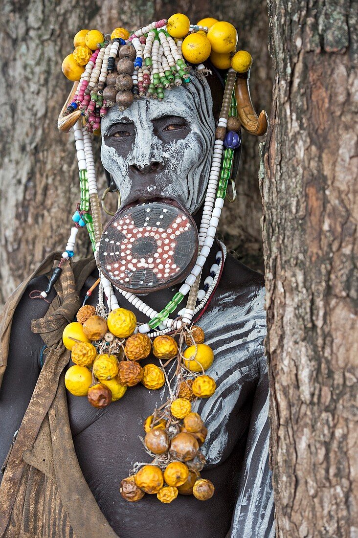 Mursi woman with lip plate and body art
