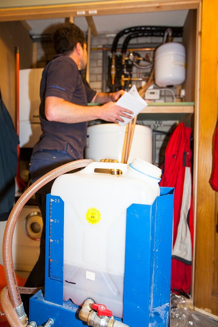 Plumber fills a solar thermal panel