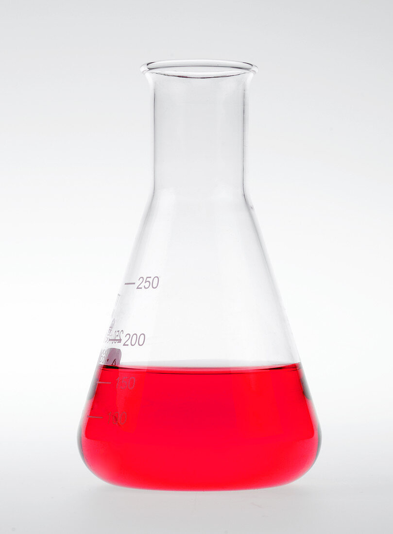 Conical flask holding red liquid