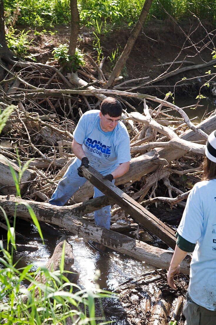 Volunteers clearing logs