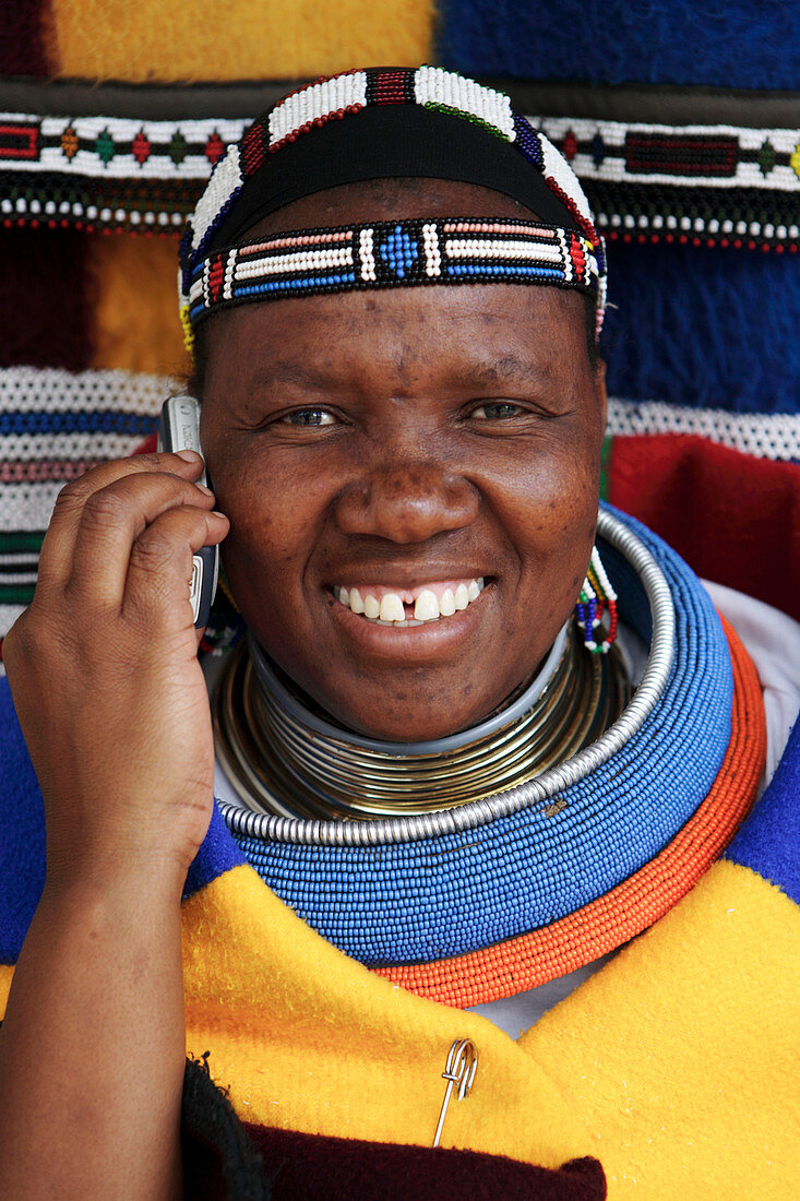 Ndebele woman using mobile phone