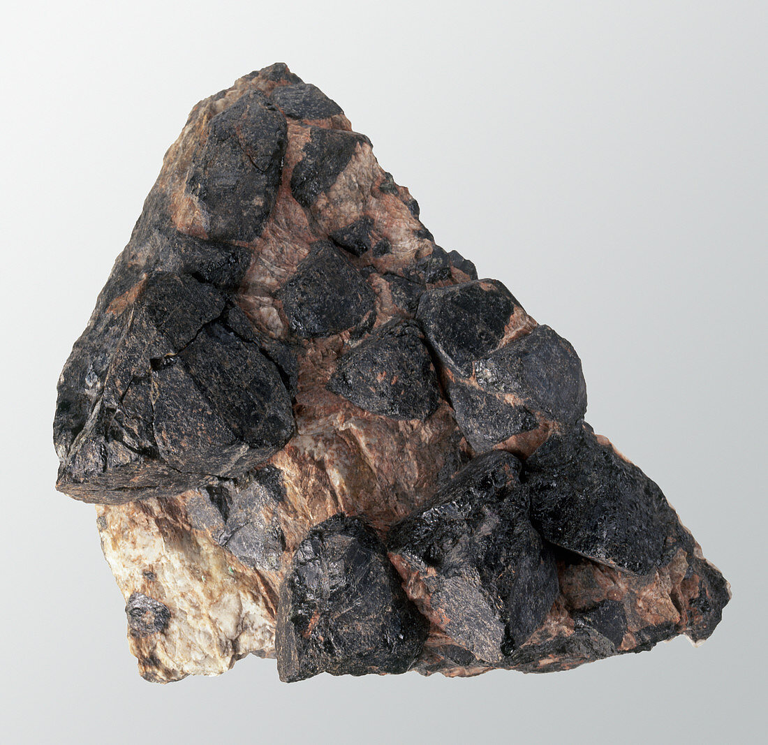 Gadolinite in rock groundmass,close-up