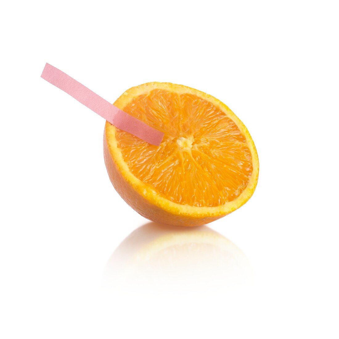 Litmus paper test on an orange