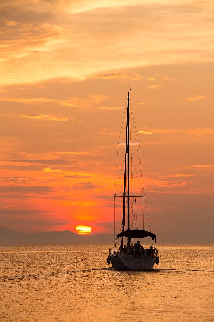 A sailing boat at sunset,Corfu