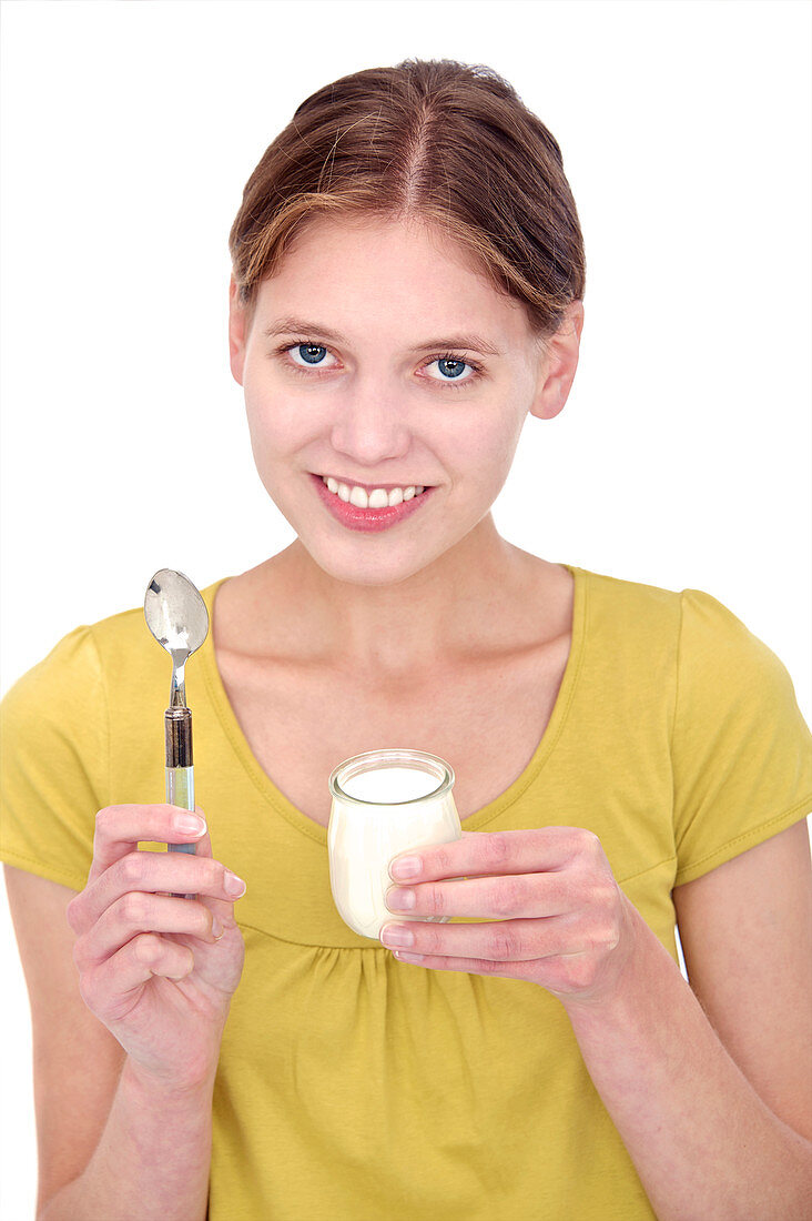 Woman holding a yoghurt