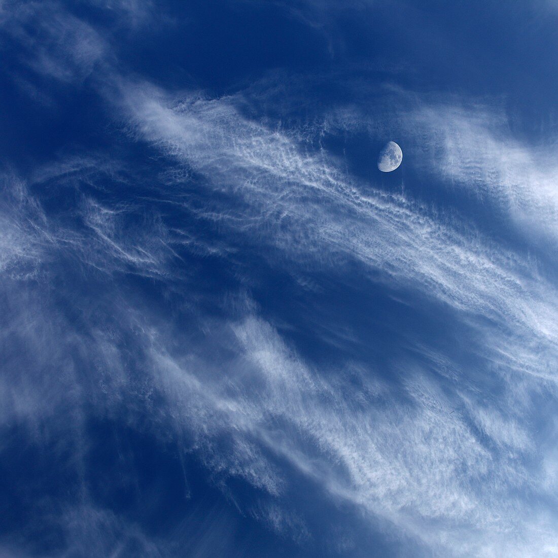 Half Moon in cloudy sky